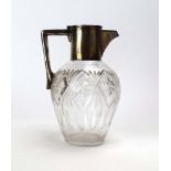 A silver mounted claret jug of plain form, maker JG&S, Birmingham 1945, h. 19.