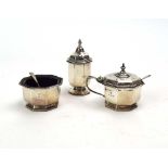 A silver three piece cruet set of octagonal form, maker WN Ltd.