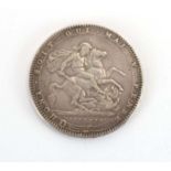 A George III silver crown, 1820, Laureate head right,