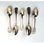 Four Victorian and later silver fiddle pattern dessert spoons, together with a further teaspoon,