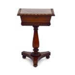 A Regency mahogany work table, the lid opening to reveal a lined interior, on a turned column,