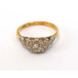 An 18ct yellow gold and platinum highlighted ring set old cut diamond in an illusion setting,