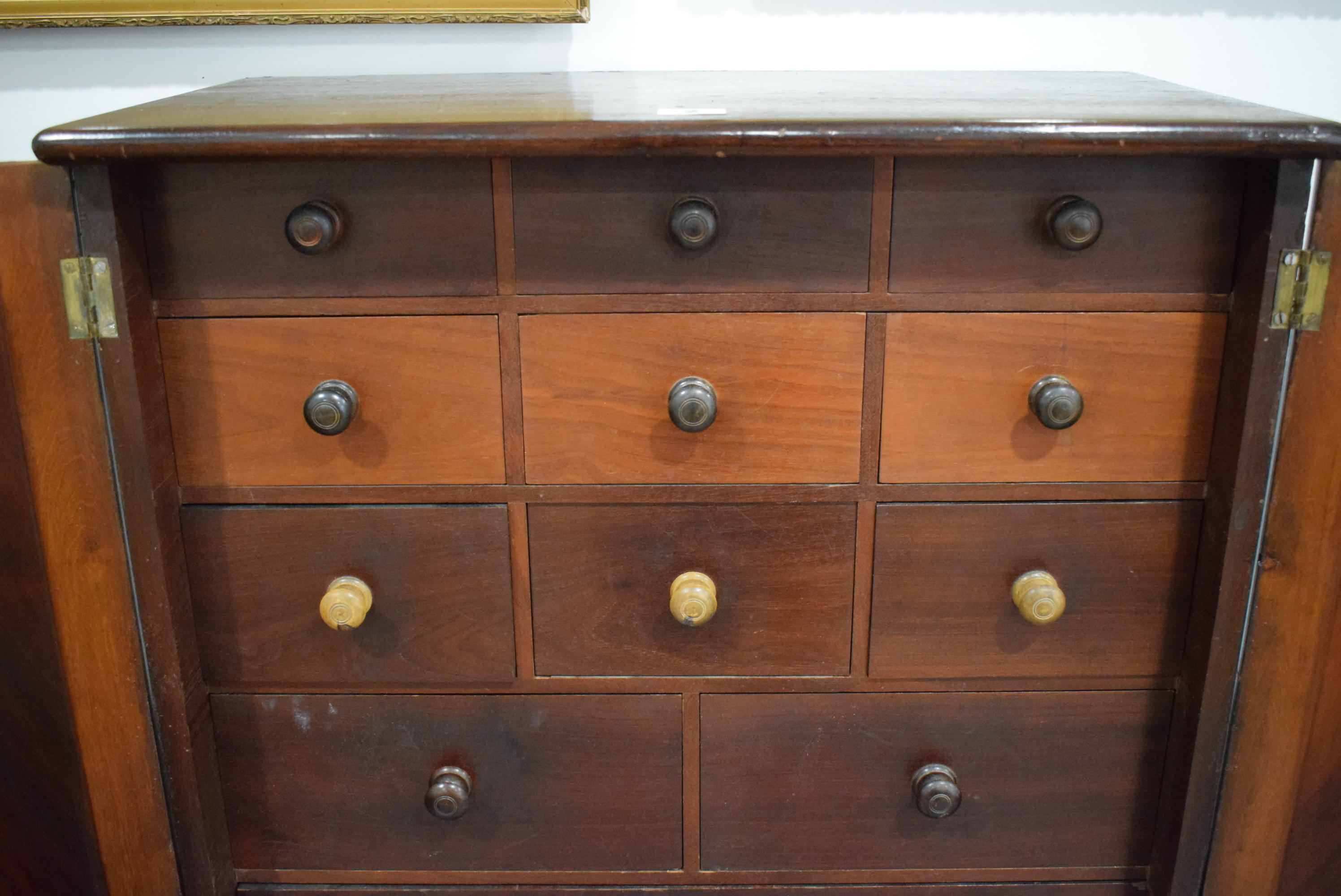 A 19th century mahogany table cabinet, the pair of doors enclosing an arrangement of twelve drawers, - Image 17 of 21