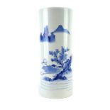 A Chinese blue and white brush pot of cylindrical form, decorated with a traditional landscape, h.