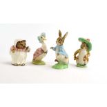 Four Beswick Beatrix Potter figures comprising: Peter Rabbit, Jemima Puddle-duck,