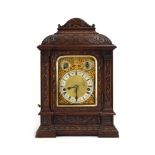 An early/mid 20th century table clock, the movement striking on a Westminster chime,