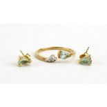 A 9ct yellow gold crossover ring set paraiba tourmaline and diamond,