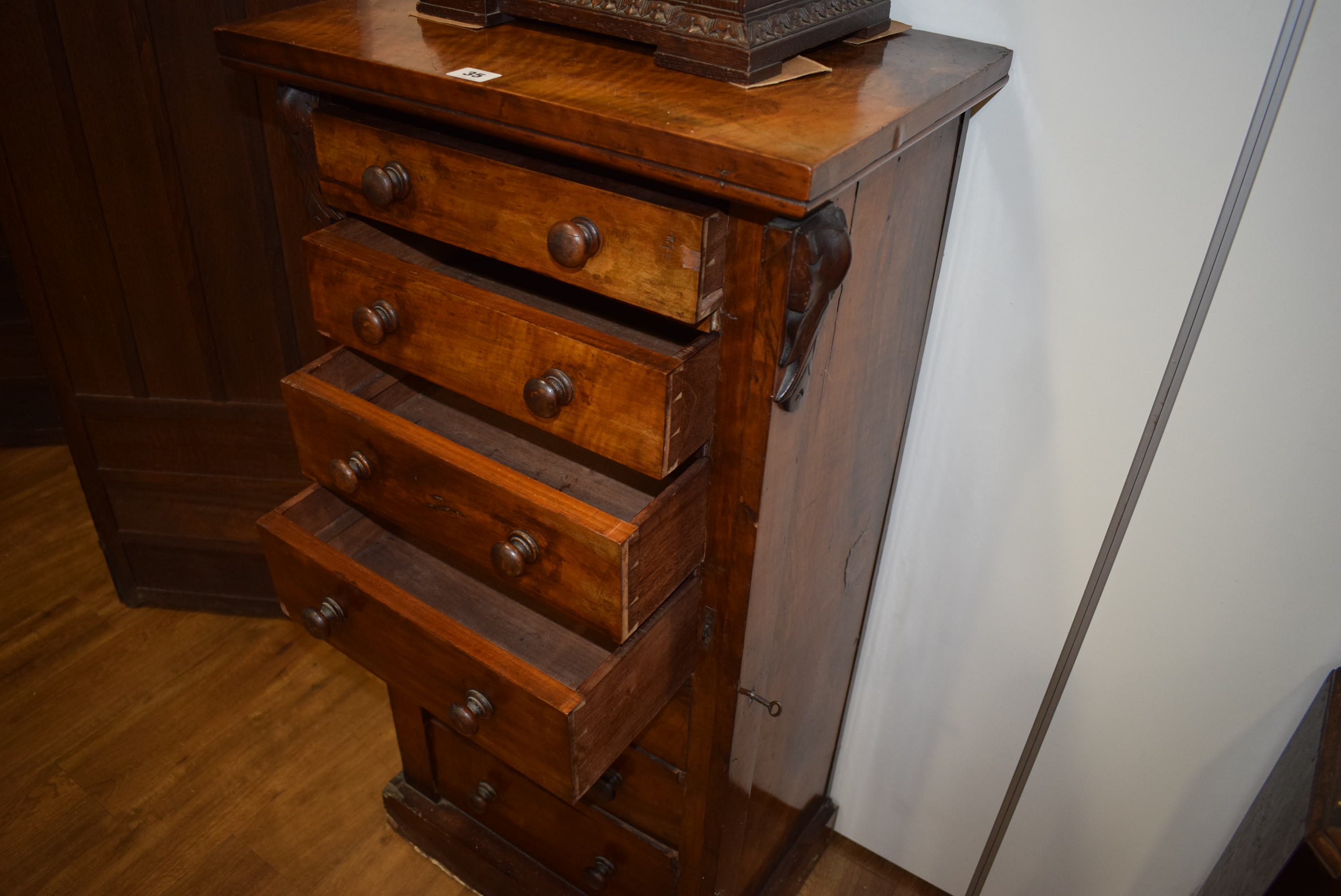 A Victorian walnut 'Wellington' chest, the seven graduated drawers flanked by a pair of columns, - Image 22 of 23