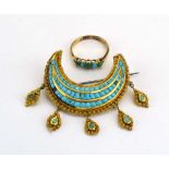 An Indian yellow metal brooch of crescent form set three rows of turquoise beads within a filigree