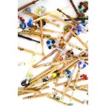 A collection of mid/late 20th century bobbins including wooden, bone,