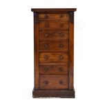 A Victorian walnut 'Wellington' chest, the seven graduated drawers flanked by a pair of columns,