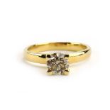 A 14ct yellow gold ring set brilliant cut diamond in a four claw setting,