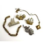 A mixed parcel of filigree jewellery comprising a butterfly brooch, two galleon brooches,