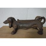 Modern cast iron boot scraper in the form of a dachshund