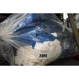 Bag containing Nautica white t-shirts