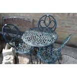 Wrought iron garden table with 3 matching chairs in green