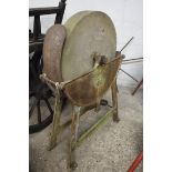 Stone grinding wheel on cast iron stand