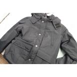 Child's weatherproof outdoor jacket in black, size L