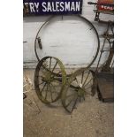 Pair of metal cart wheels and 1 larger cart wheel framework