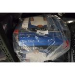 Bag containing Nautica white t-shirts