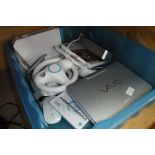 Box containing Nintendo Wii accessories incl. steering wheels, Wii console and games together with