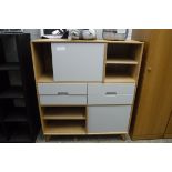 Modern oak bedroom storage unit with cupboards and drawers
