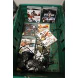 Crate containing 2 PS3 controllers and quantity of games incl. FIFA and Assassin's Creed