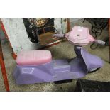 Pink and purple plastic child's seat in the form of a scooter