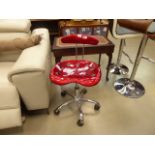 Red moulded plastic swivel office chair