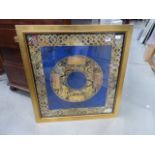 **Withdrawn**Framed and glazed gold and blue pattern wall hanging
