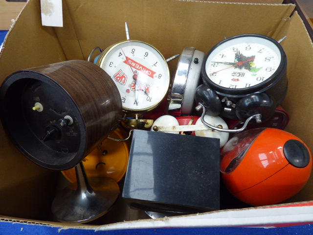 Box containing a collection of alarm clocks