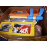 Two boxes containing children's toys, Lego, dolls and board games