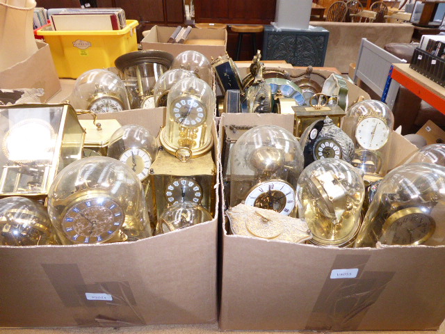 Four boxes containing wall clocks, carriage and mantle clocks