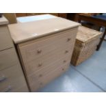 A narrow beech finish chest of six drawers and a beech finish chest of four drawers