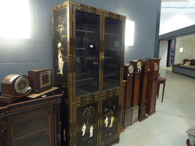 Inlaid and black lacquered Oriental display cabinet