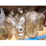 Large collection of clocks with glass domes