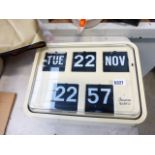 Quartz wall clock with date, day and month