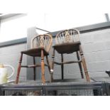 Two elm seated wheel back dining chairs