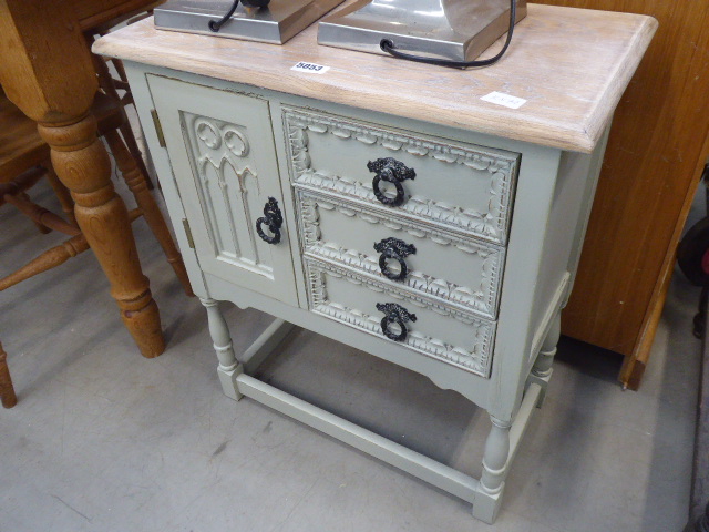 Painted oak cabinet on raised supports