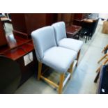 Pair of grey fabric and wooden chairs