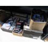 Five boxes containing a large quantity of CDs and DVDs