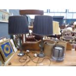 Pair of metal table lamps with reeded columns and black pleated shades