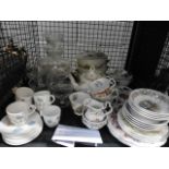 Cage containing a Royal Doulton Brambly Hedge tea service, plus glassware and Wedgewood crockery