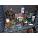 Cage containing figure of a soldier, propeller, vintage Pepsi tin, car horn, medals and die cast