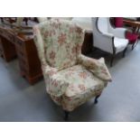Brown floral wing back armchair