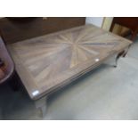 5058 A natural wood coffee table on a silver painted base