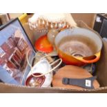 Two boxes containing framed photographs Le Creuset pots and onyx table lamp, general glassware,