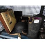 Cage containing a tin helmet, vintage radio plus binoculars and other instruments