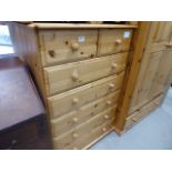 A pine chest of two over five drawers