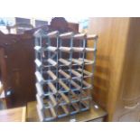 A metal and pine wine rack
